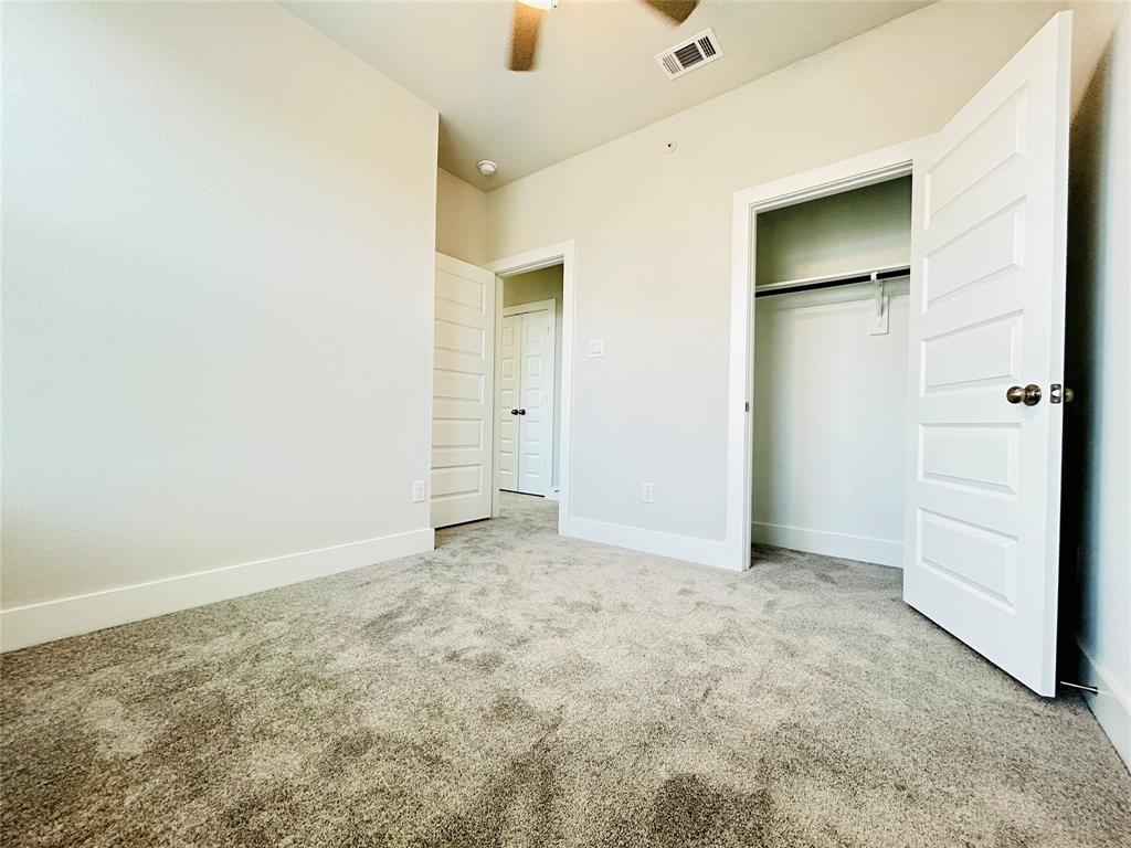 760 West Bedford Euless Road, Unit 214 Hurst, TX 76053 - Photo 31 of 32 an empty room with closet