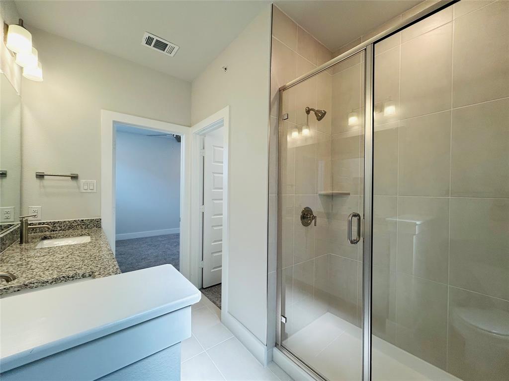 760 West Bedford Euless Road, Unit 214 Hurst, TX 76053 - Photo 32 of 32 a bathroom with a shower and a sink