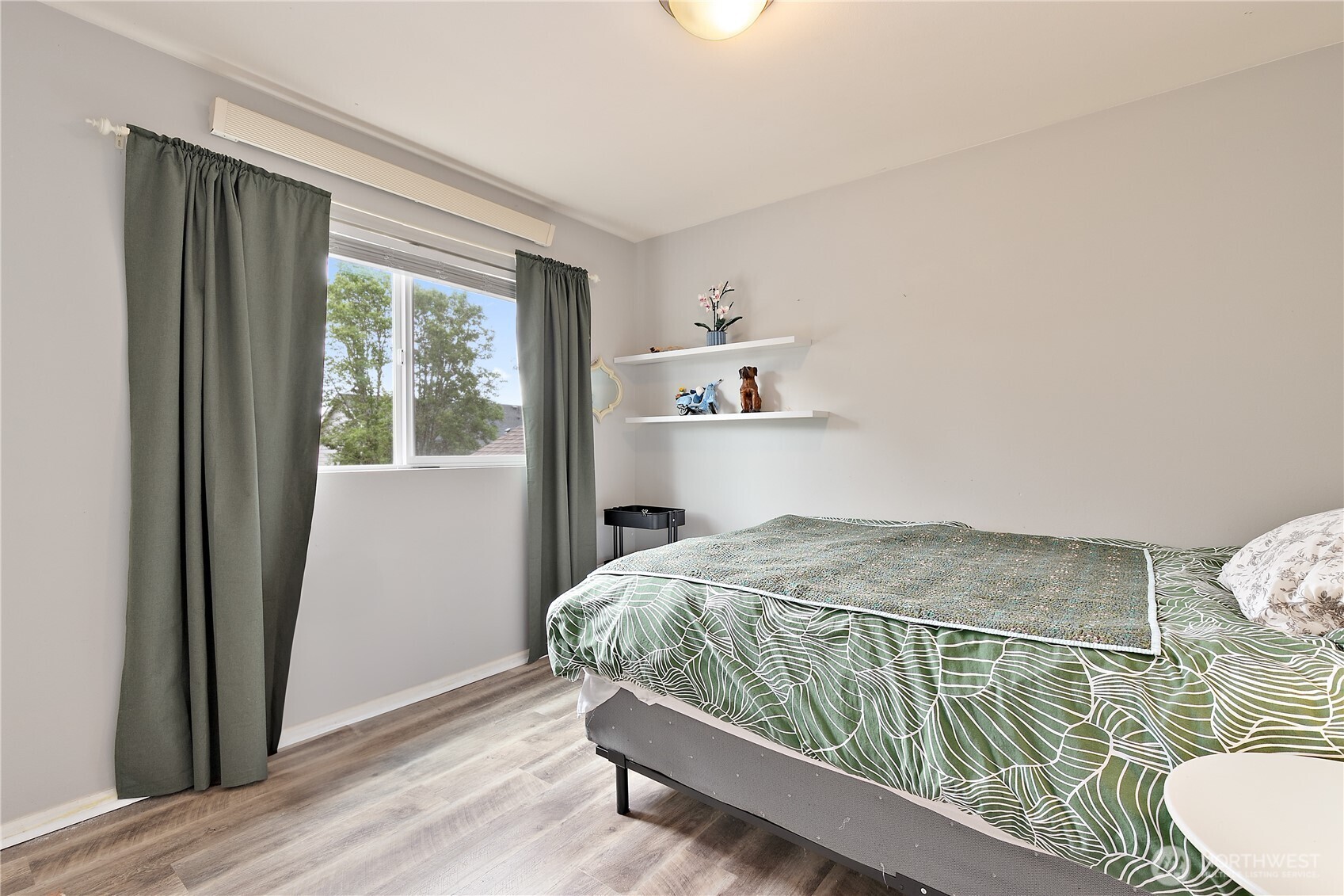 6600 Indiana Street Southeast Lacey, WA 98513 - Photo 18 of 21 a bedroom with a bed and wooden floor