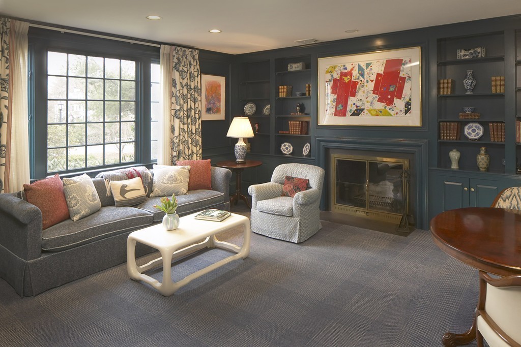 24 Carisbrooke Road Wellesley, MA 02481 - Photo 5 of 13 a living room with furniture a fireplace and a flat screen tv