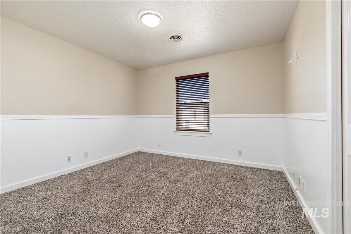 237 16th Avenue North Payette, ID 83661 - Photo 19 of 36 Unfurnished room with a textured ceiling and carpet floors