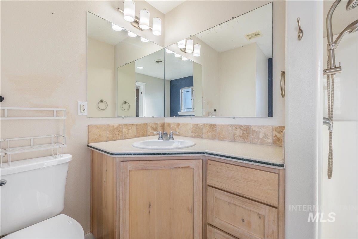 237 16th Avenue North Payette, ID 83661 - Photo 25 of 36 Bathroom featuring vanity and toilet