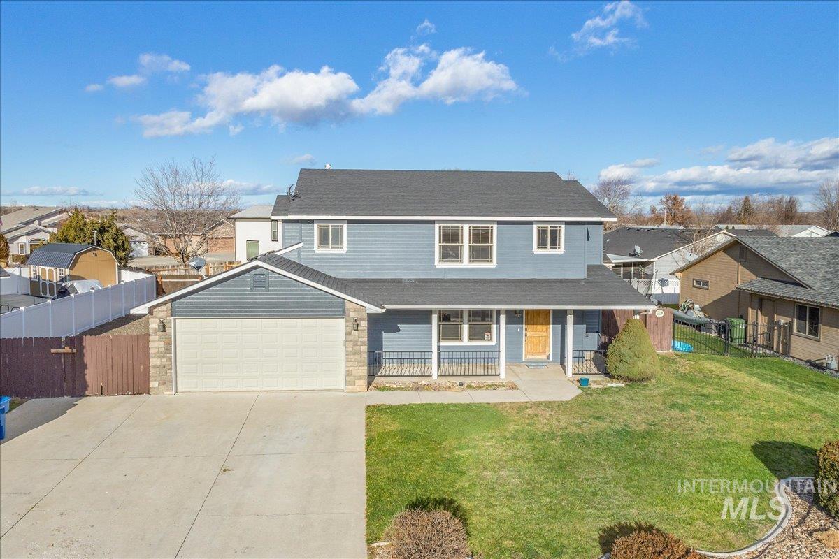 237 16th Avenue North Payette, ID 83661 - Photo 29 of 36 Traditional home featuring a porch, driveway, and an attached garage