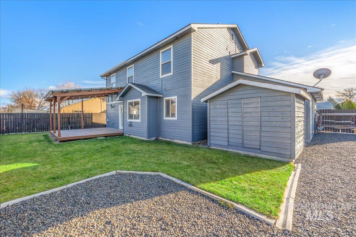 237 16th Avenue North Payette, ID 83661 - Photo 35 of 36 Back of house featuring a fenced backyard and a wooden deck