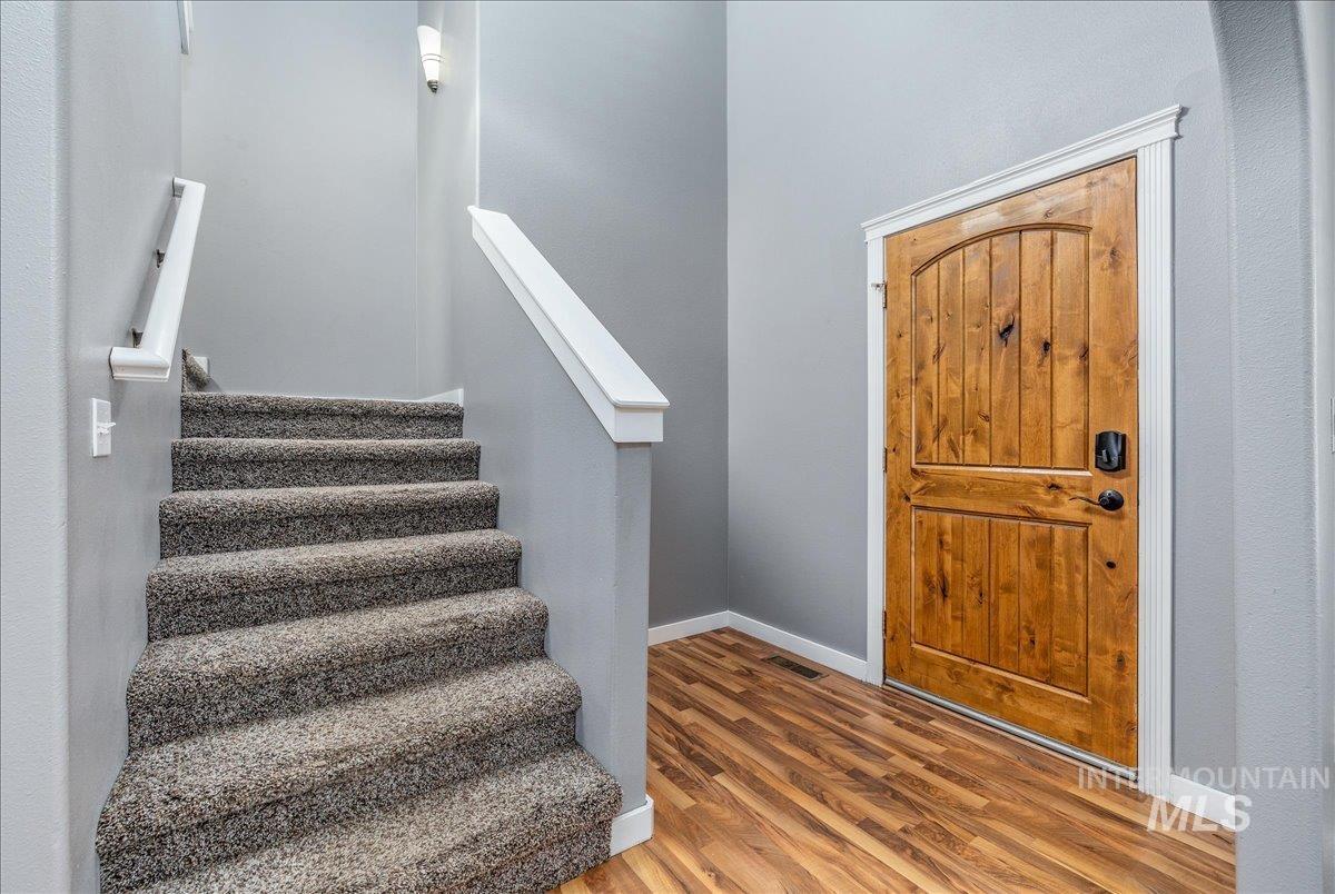 237 16th Avenue North Payette, ID 83661 - Photo 5 of 36 Entryway featuring stairway and wood finished floors