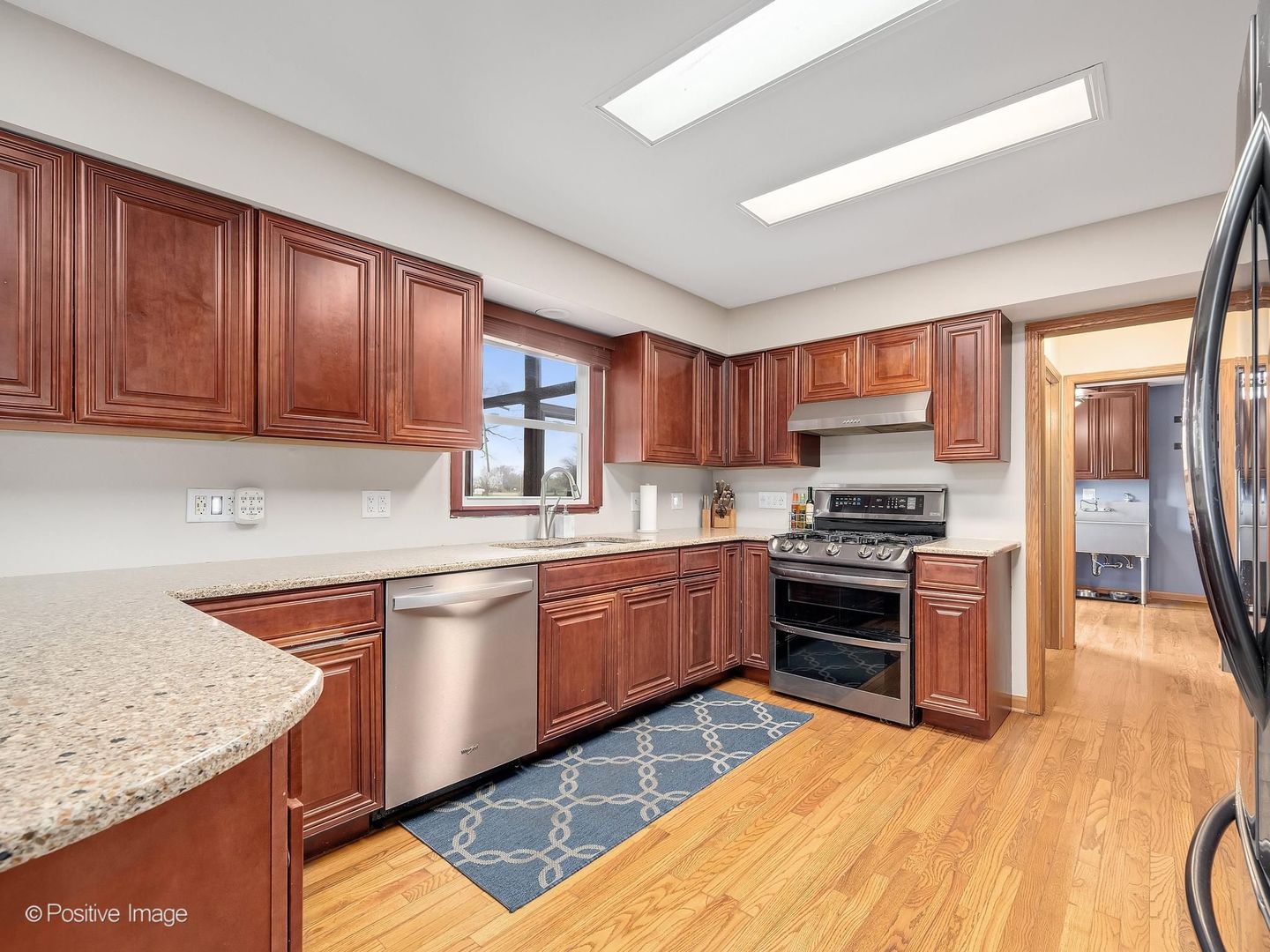 612 Stuart Drive Carol Stream, IL 60188 - Photo 10 of 29 a kitchen with stainless steel appliances granite countertop a sink stove and refrigerator