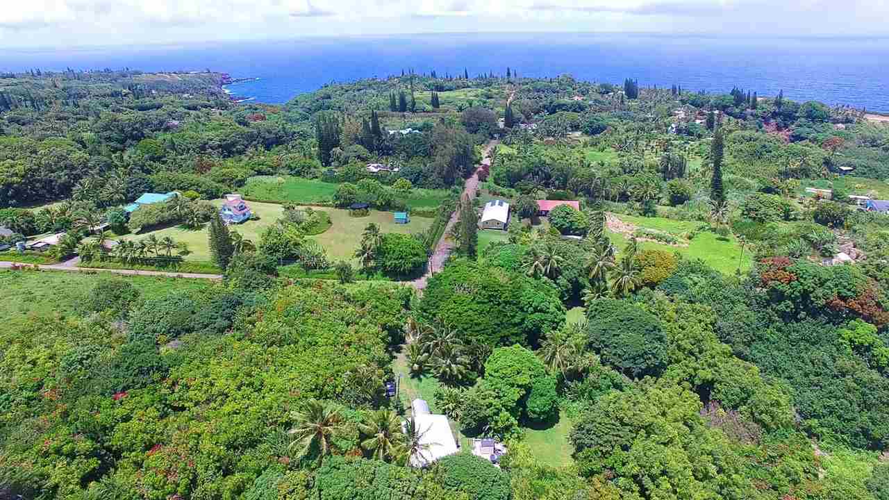 28 Door Of Faith Road Haiku, HI 96708 - Photo 17 of 29 an aerial view of a city with lots of residential buildings and mountain view in back