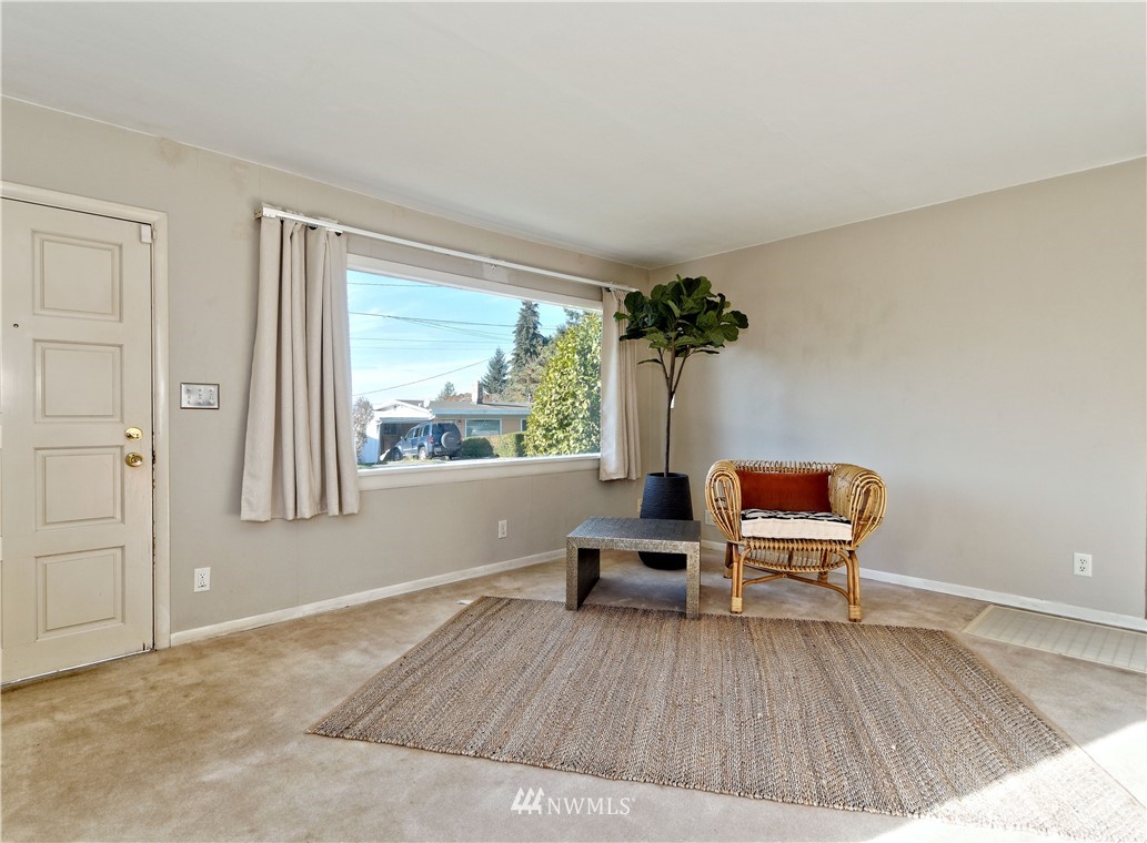 2189 Northeast 9th Place Renton, WA 98056 - Photo 2 of 21 a view of a bedroom with furniture and window