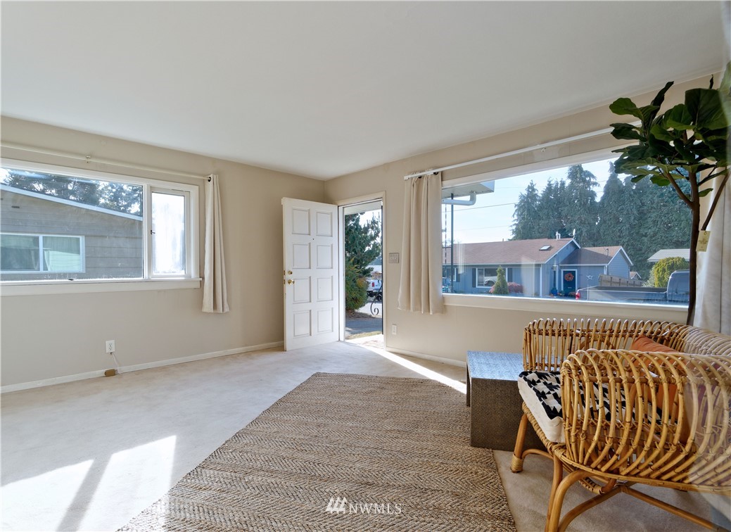 2189 Northeast 9th Place Renton, WA 98056 - Photo 4 of 21 a view of a porch with furniture and a yard