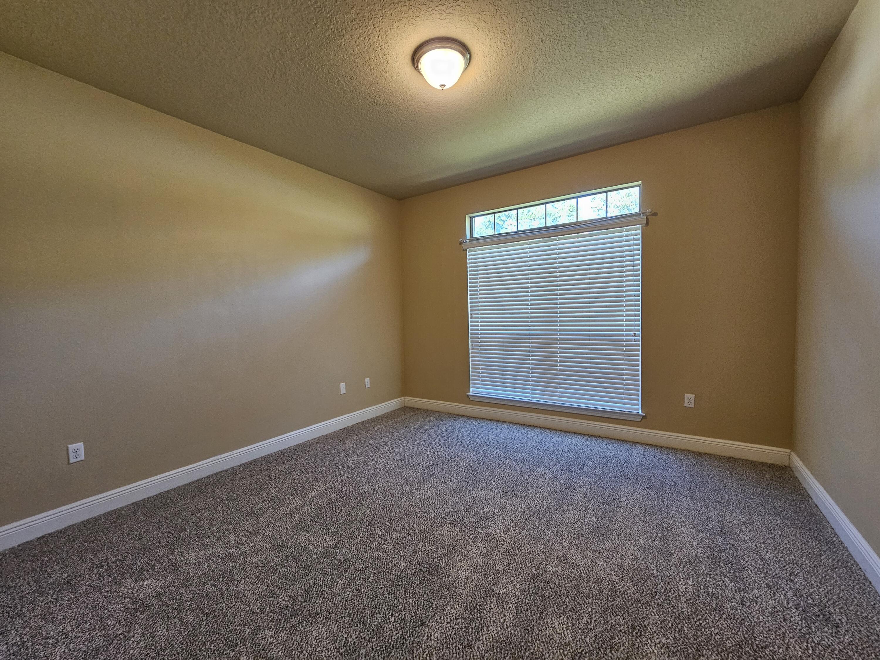 660 Red Fern Road Crestview, FL 32536 - Photo 18 of 22 a view of an empty room with a window