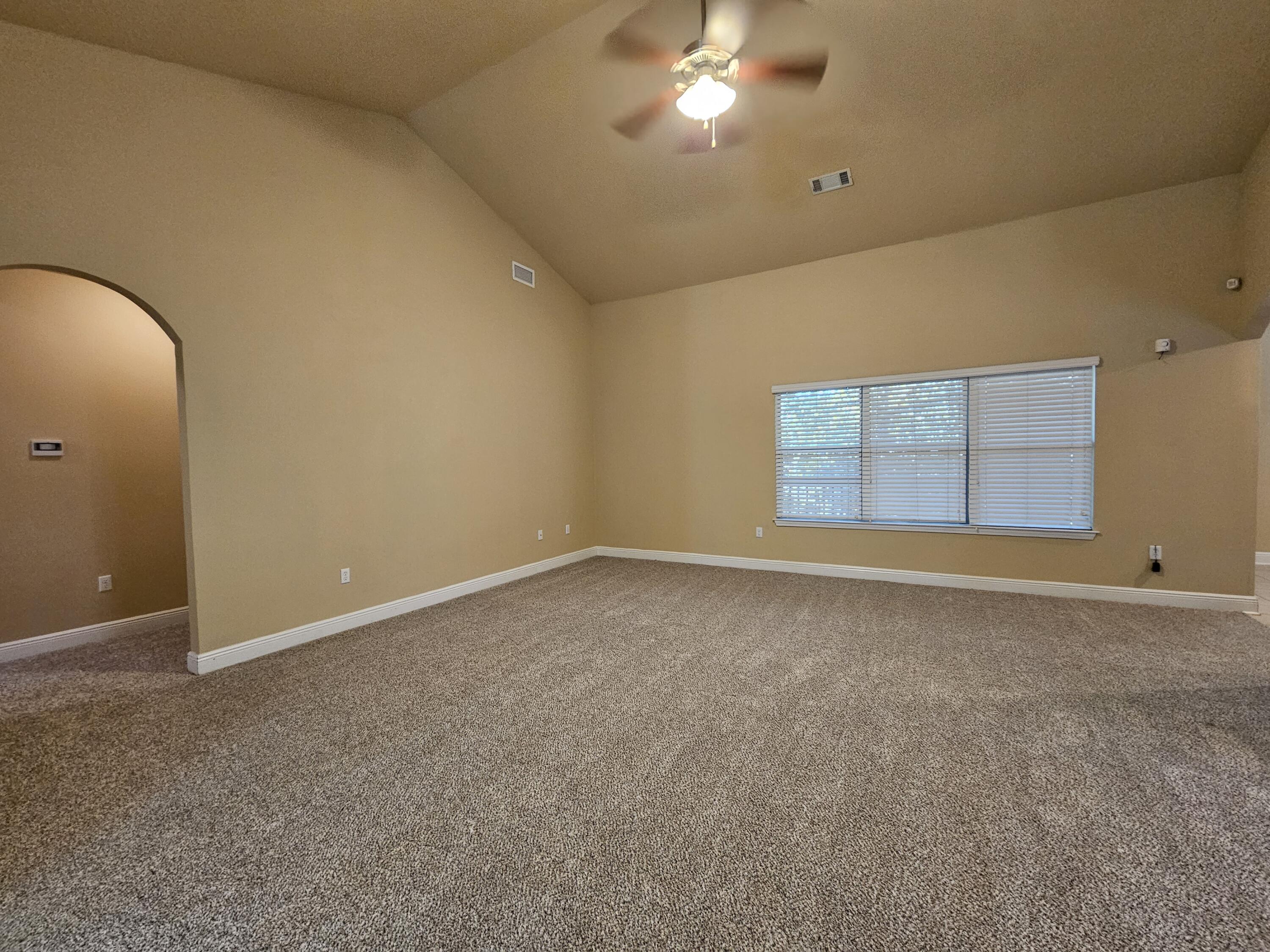 660 Red Fern Road Crestview, FL 32536 - Photo 4 of 22 an empty room with a empty space and chandelier fan