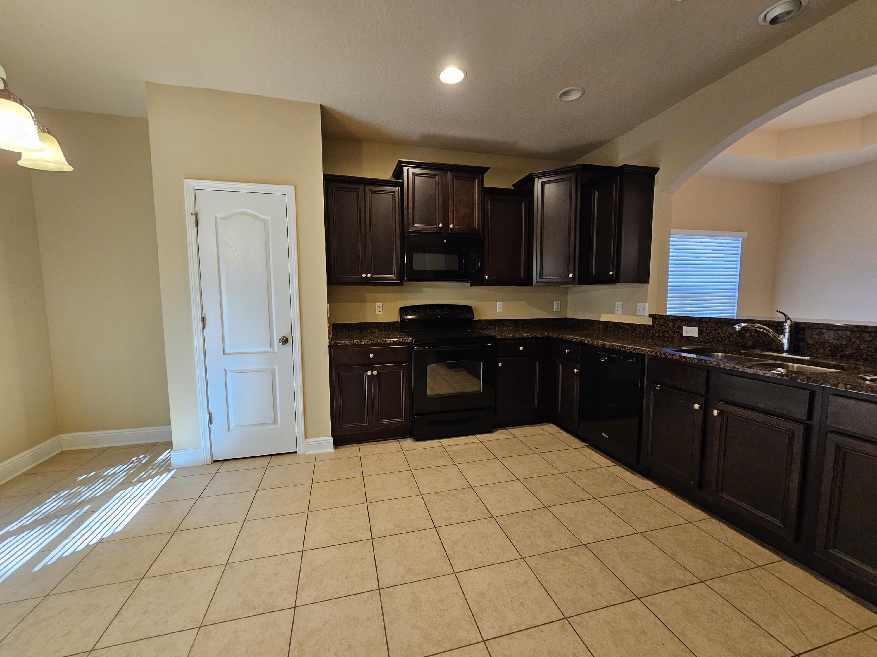 660 Red Fern Road Crestview, FL 32536 - Photo 8 of 22 a kitchen with a sink and cabinets