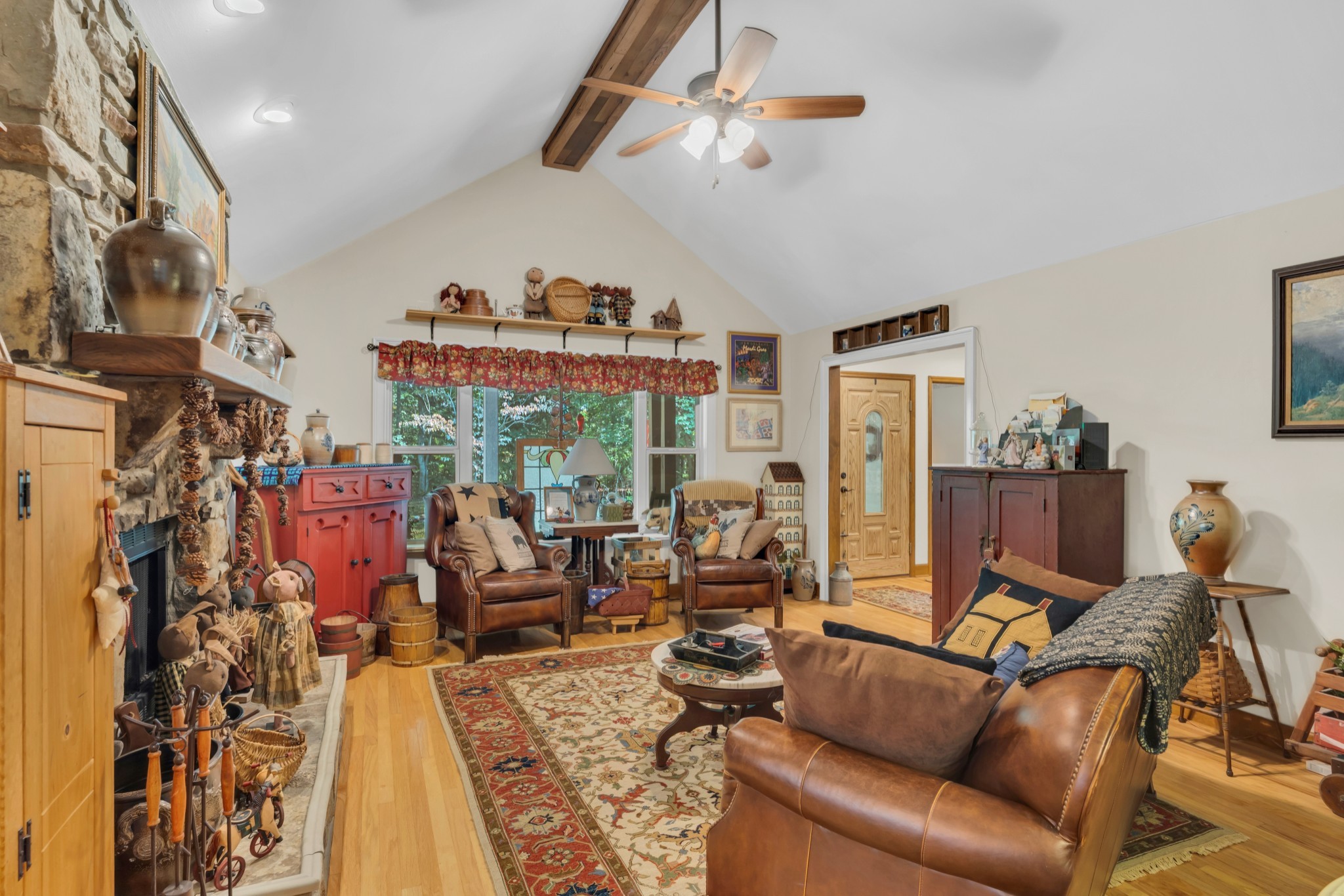7197 Highland Road Portland, TN 37148 - Photo 12 of 92 a living room with furniture a ceiling fan and a rug
