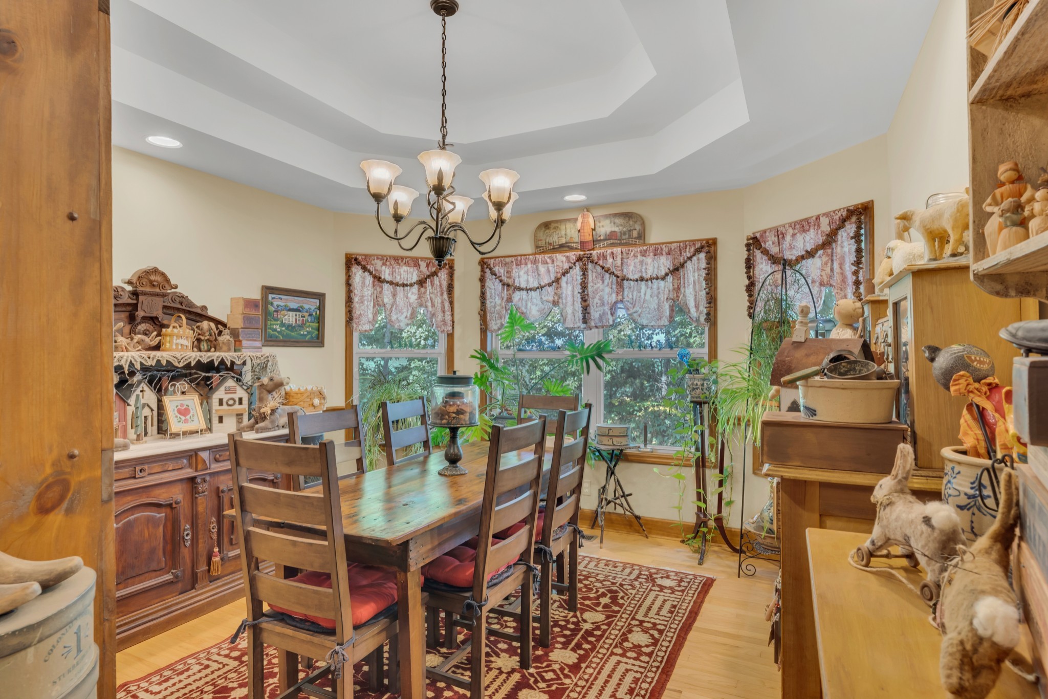 7197 Highland Road Portland, TN 37148 - Photo 13 of 92 a view of a dining room with furniture a chandelier and wooden floor