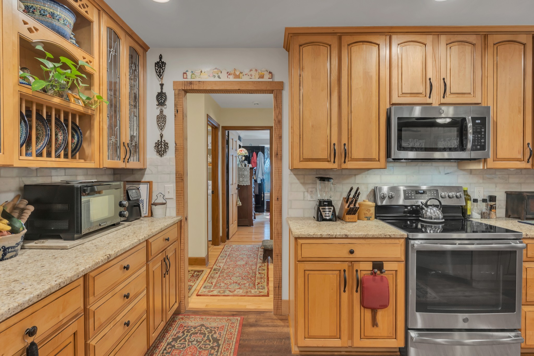 7197 Highland Road Portland, TN 37148 - Photo 21 of 92 a kitchen with stainless steel appliances granite countertop a stove a sink and a microwave