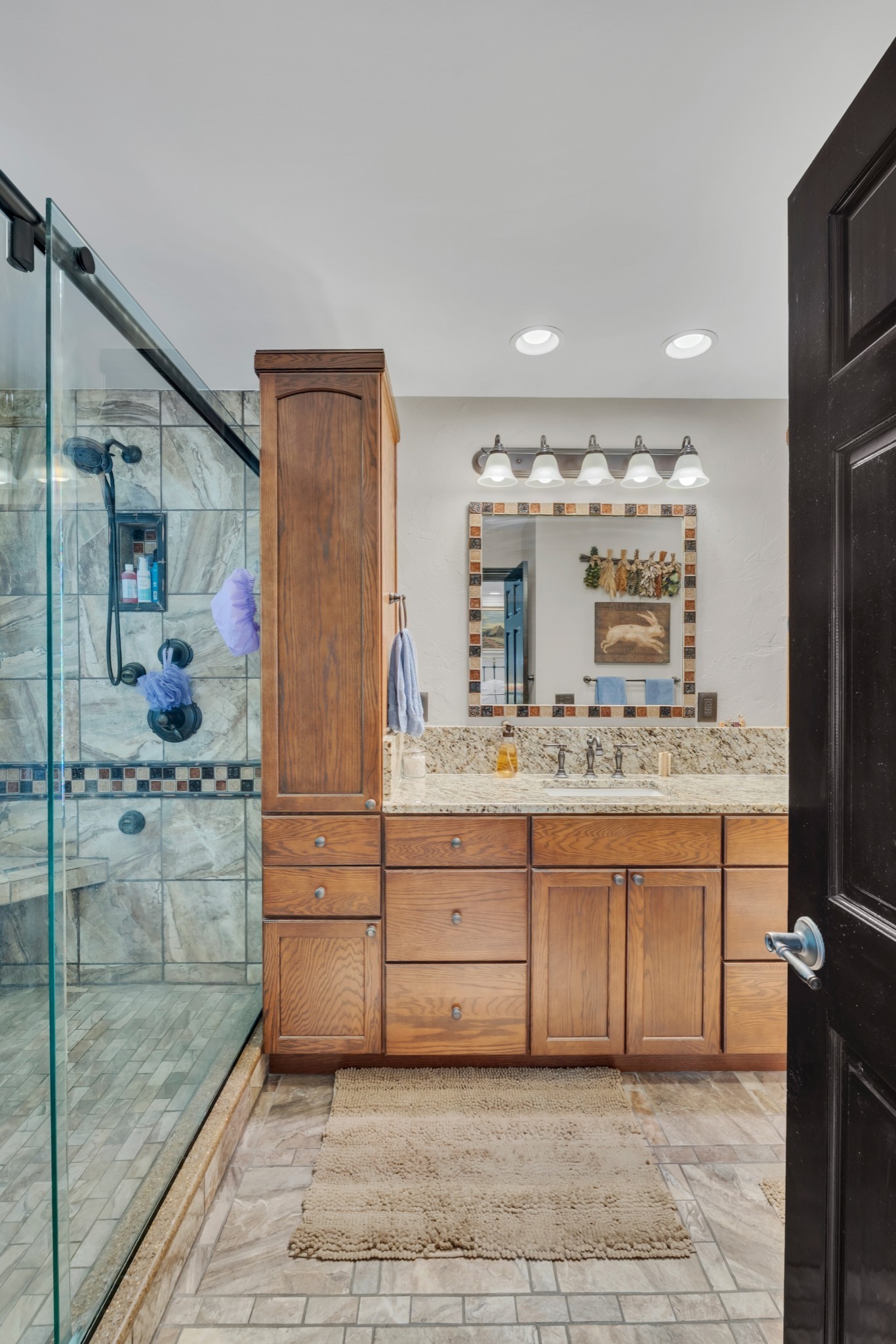 7197 Highland Road Portland, TN 37148 - Photo 24 of 92 a bathroom with a granite countertop sink a mirror and a shower