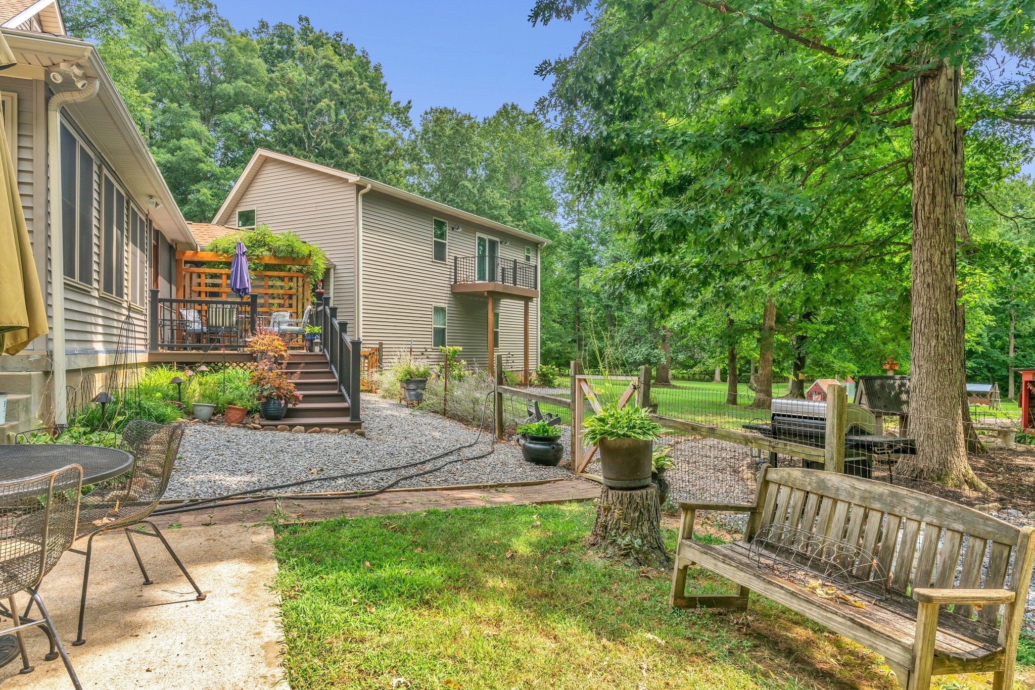 7197 Highland Road Portland, TN 37148 - Photo 47 of 92 a view of a chair and table in backyard of the house