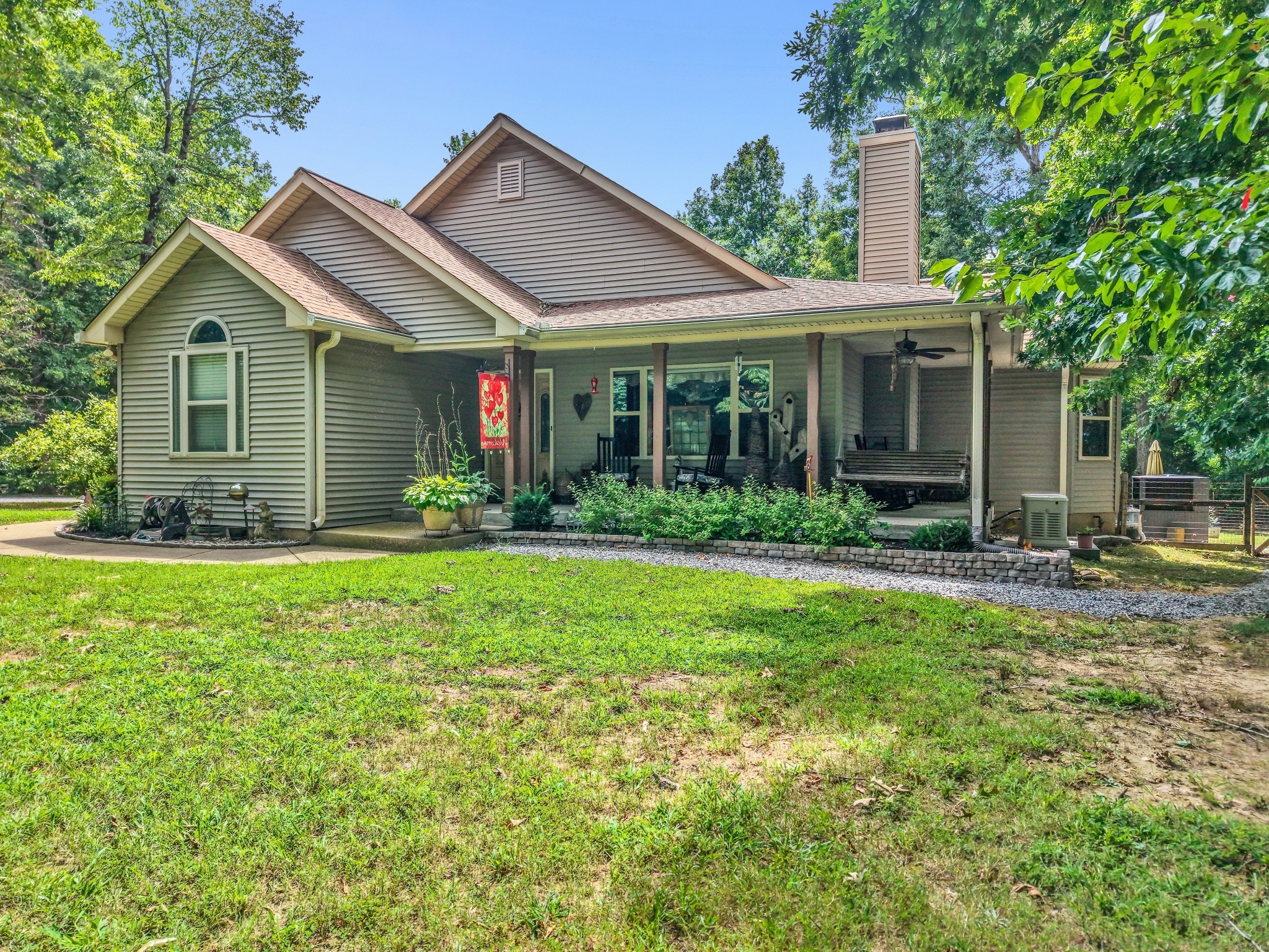 7197 Highland Road Portland, TN 37148 - Photo 5 of 92 a front view of a house with garden