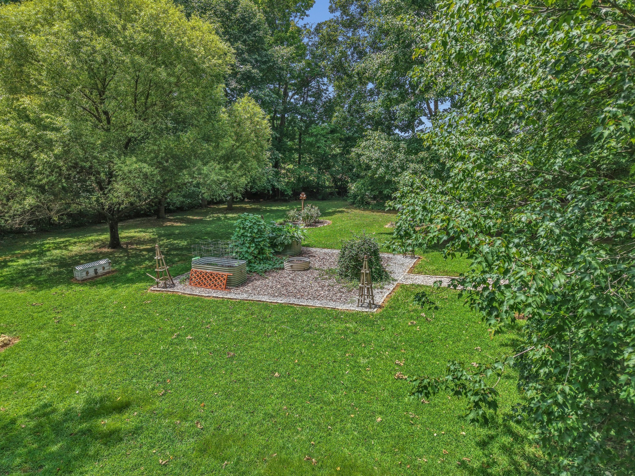 7197 Highland Road Portland, TN 37148 - Photo 71 of 92 a view of a garden with a lake