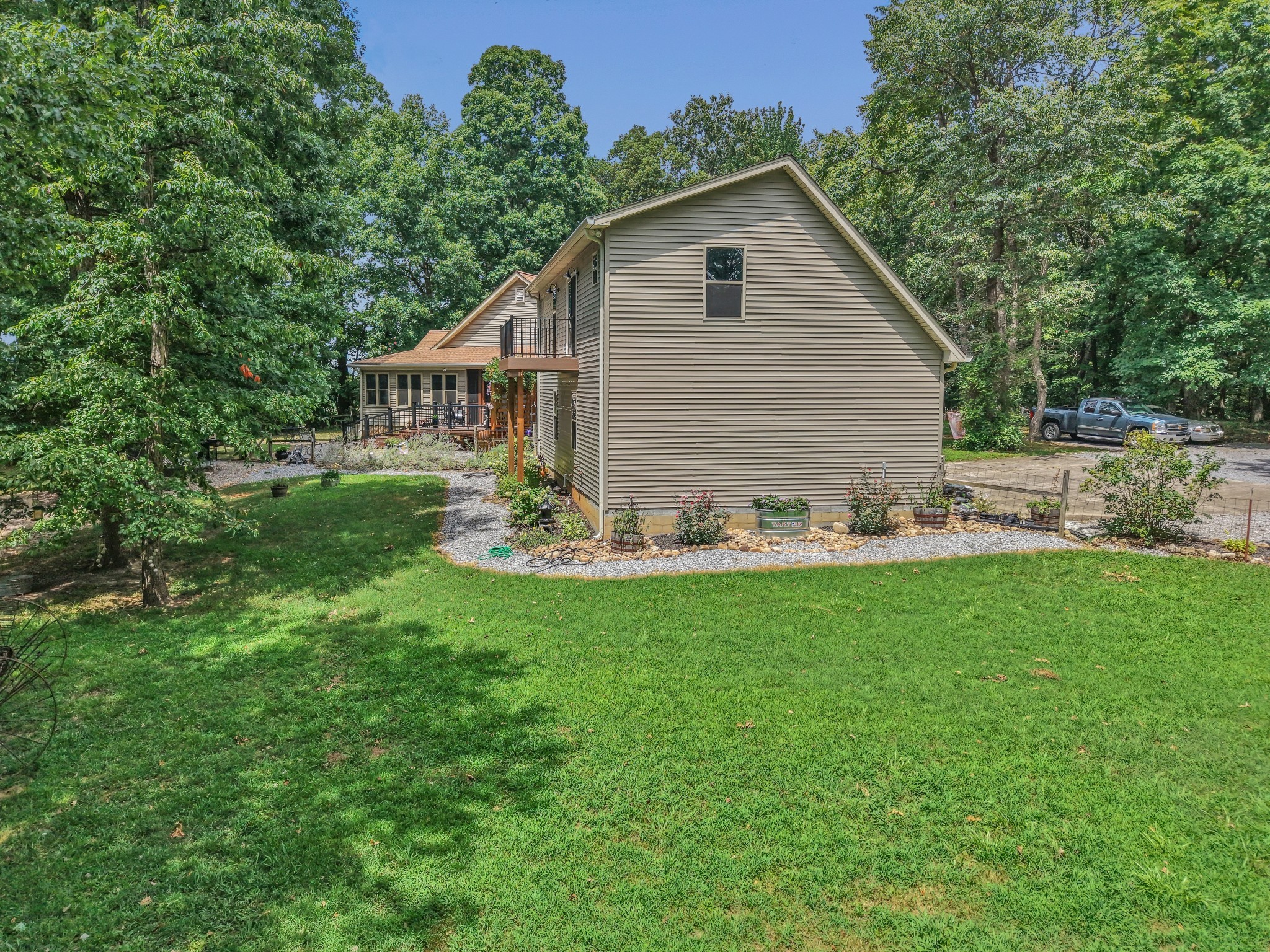 7197 Highland Road Portland, TN 37148 - Photo 74 of 92 a backyard of a house with table and chairs