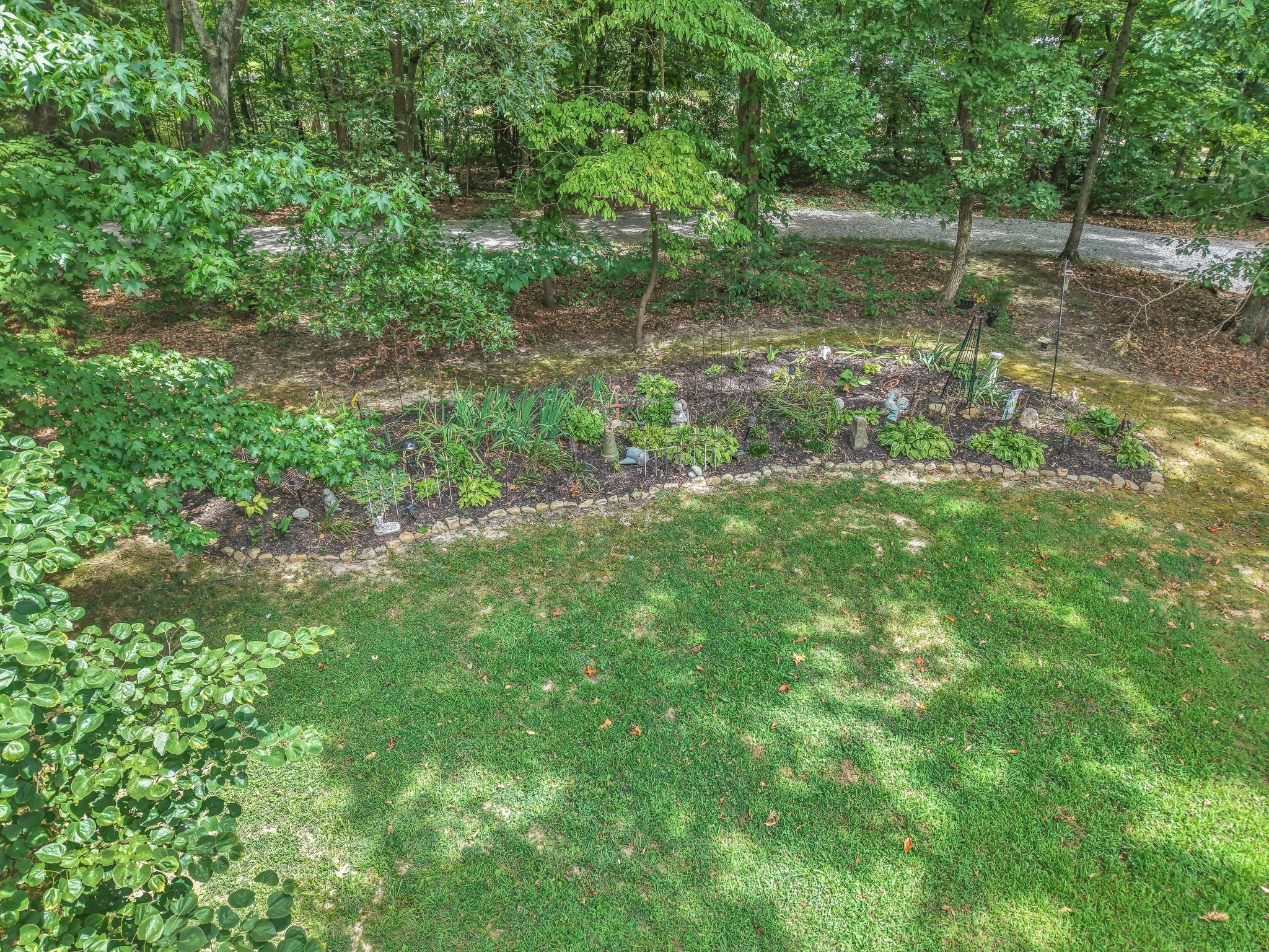 7197 Highland Road Portland, TN 37148 - Photo 82 of 92 a backyard of a house with lots of green space and lake view