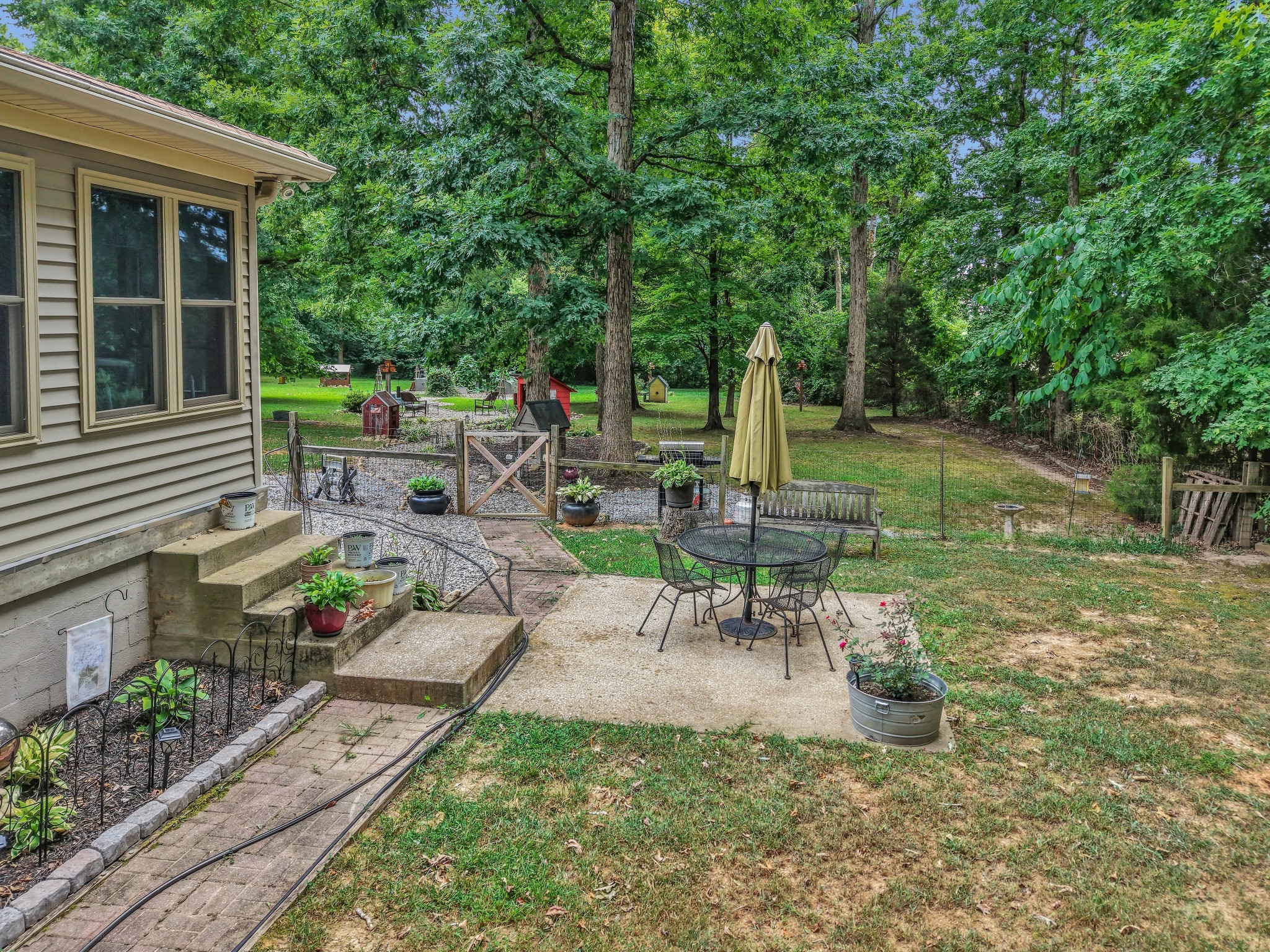 7197 Highland Road Portland, TN 37148 - Photo 83 of 92 a view of a chair and table in backyard of the house