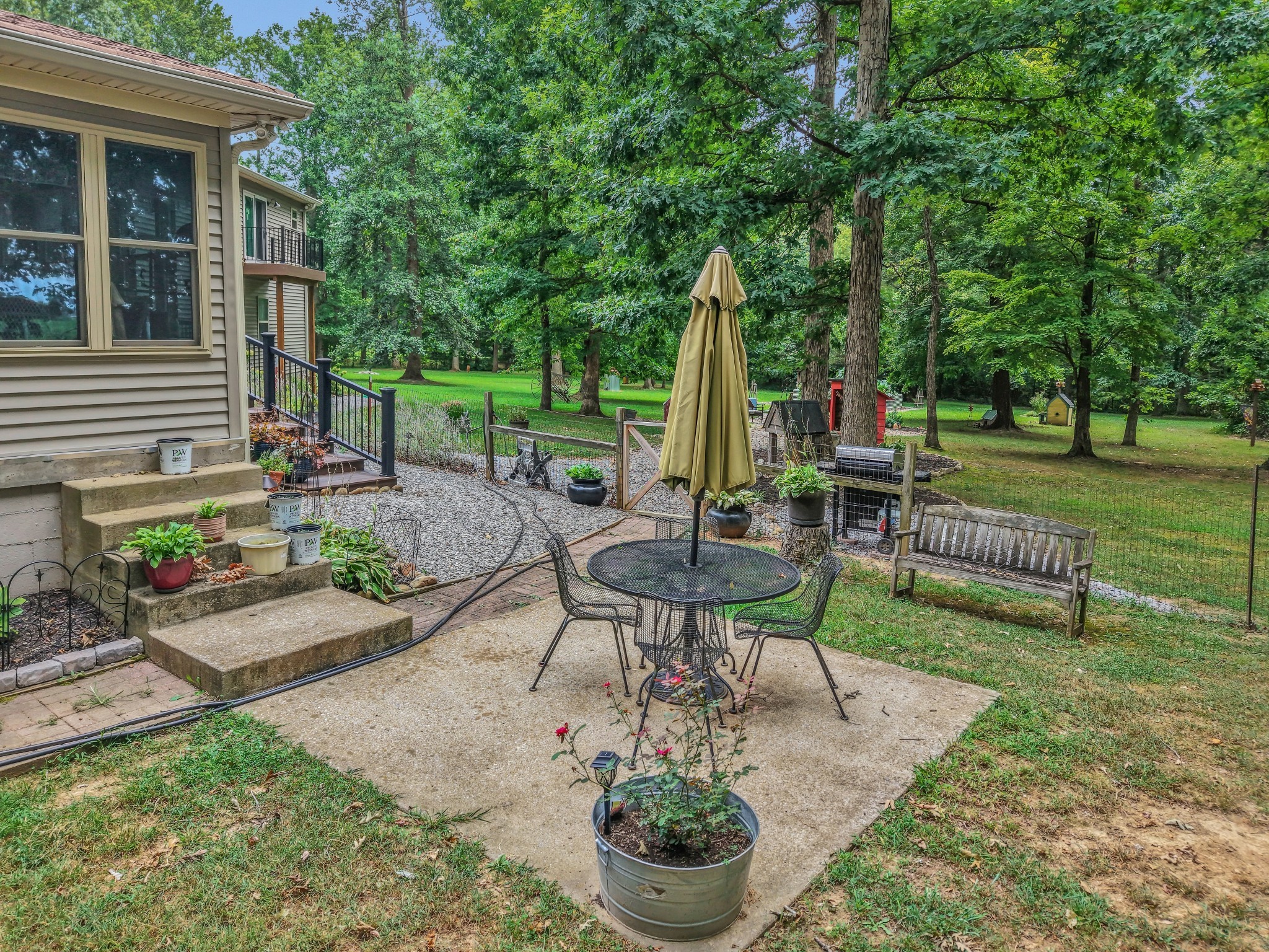 7197 Highland Road Portland, TN 37148 - Photo 84 of 92 a view of a chair and table in backyard of the house