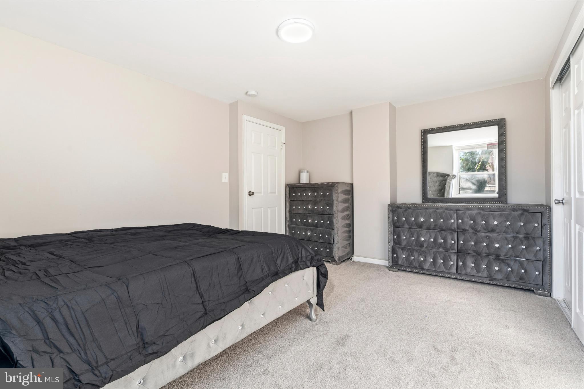 7713 Burnside Road Landover, MD 20785 - Photo 17 of 23 Serene bedroom with modern elegance.
