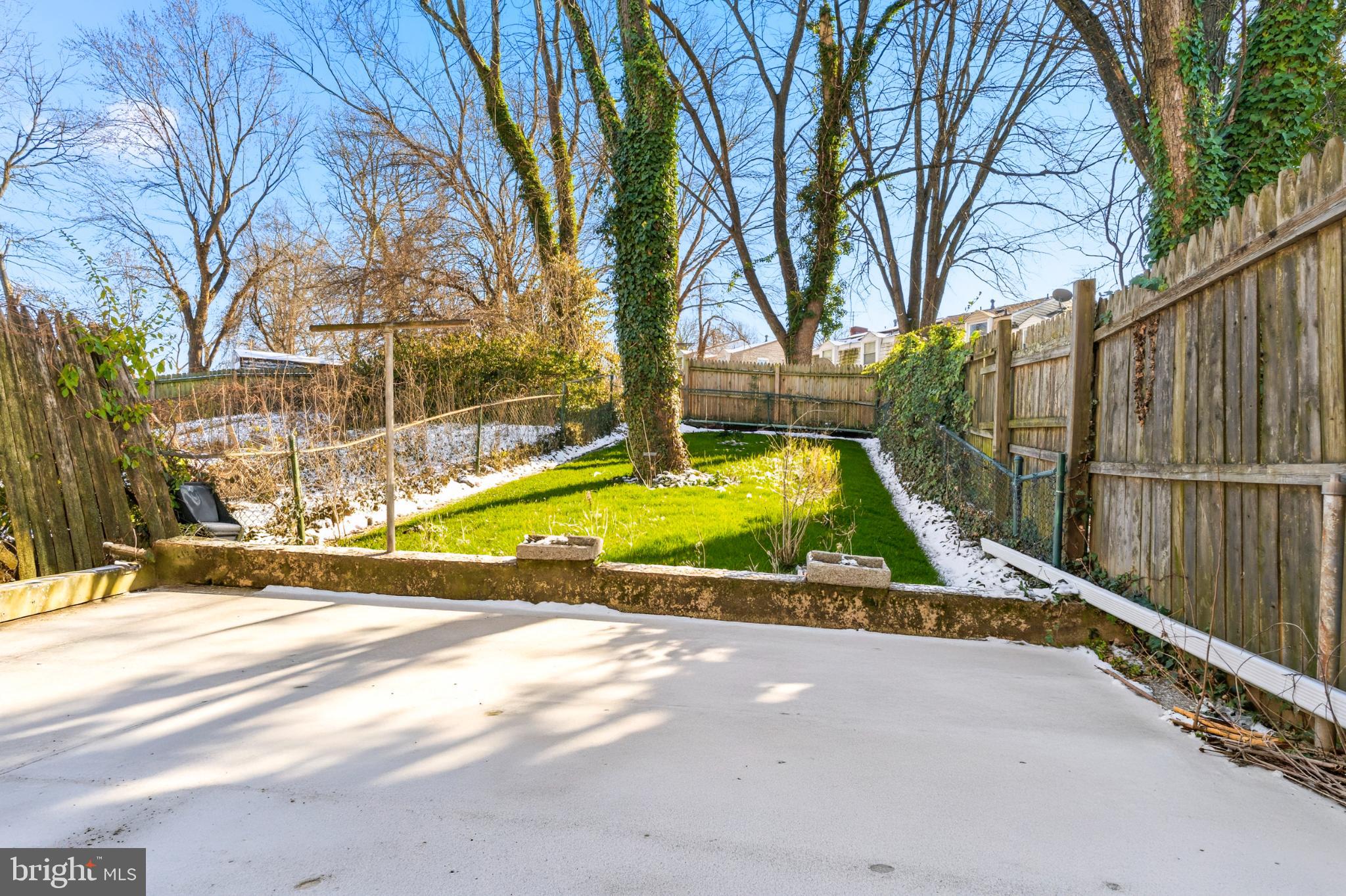 7713 Burnside Road Landover, MD 20785 - Photo 21 of 23 Serene backyard oasis with lush greenery.
