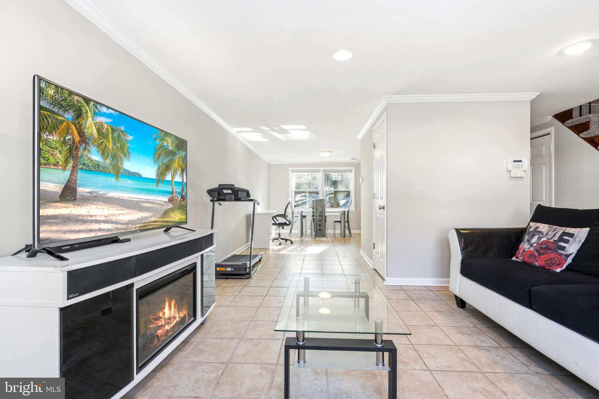 7713 Burnside Road Landover, MD 20785 - Photo 4 of 23 Modern living space with serene beach vibes.