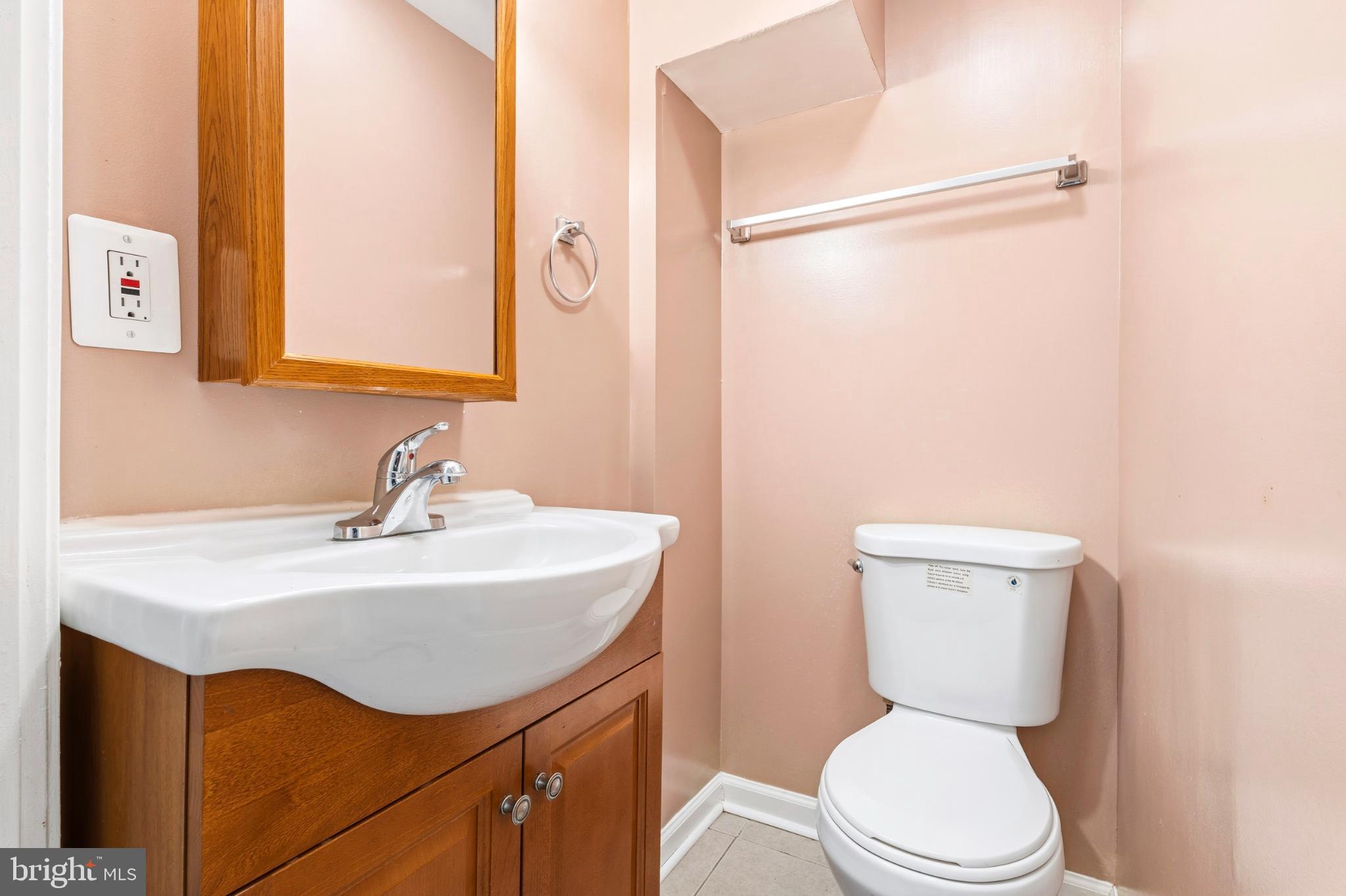 7713 Burnside Road Landover, MD 20785 - Photo 8 of 23 Charming powder room with modern touches.