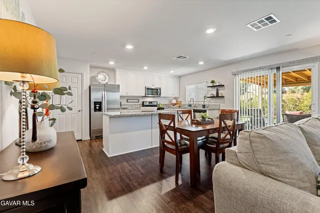 a view of a dining room with furniture and a table