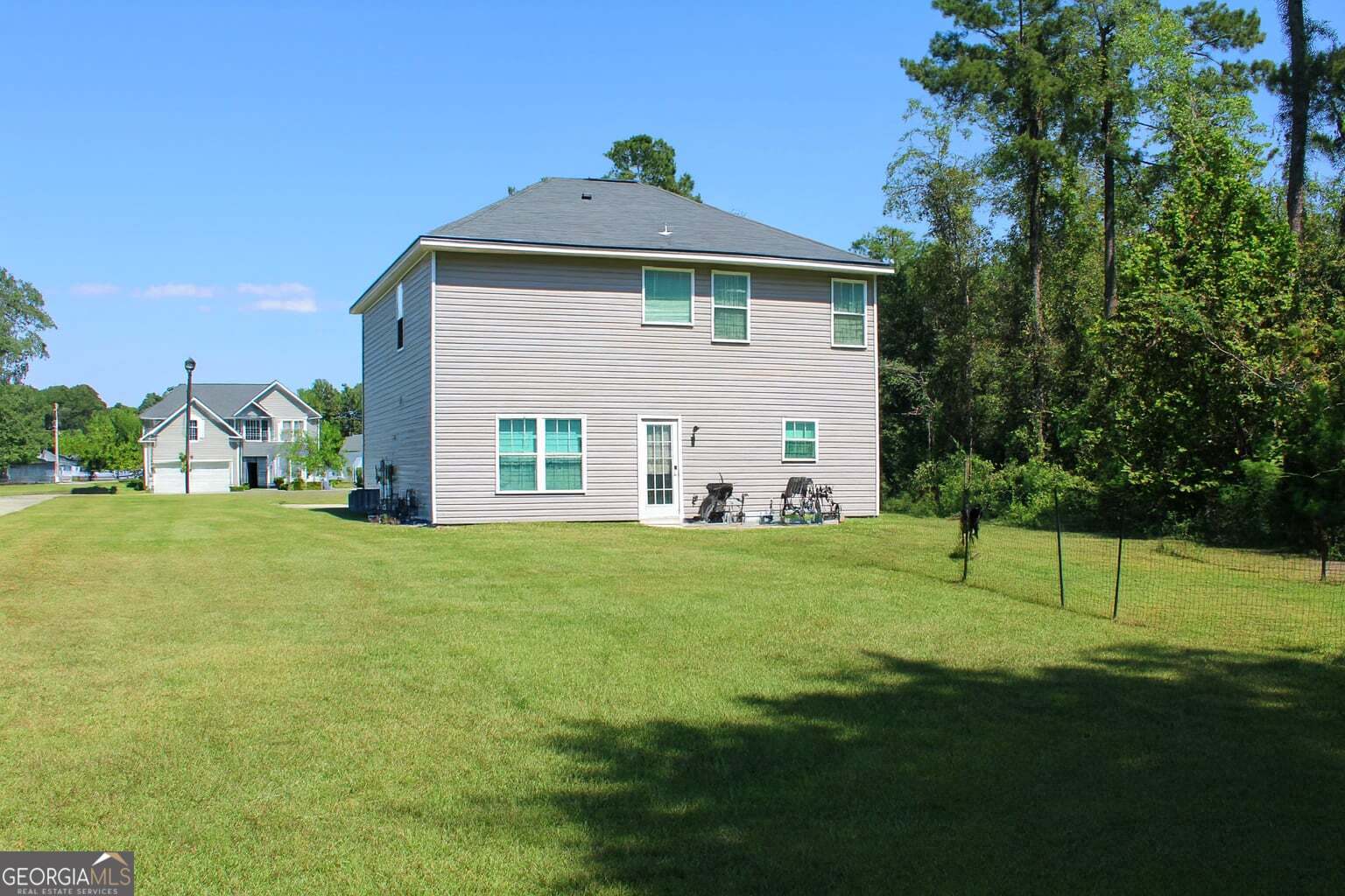 1343 Talmadge Road Allenhurst, GA 31301 - Photo 17 of 17 a front view of a house with a yard