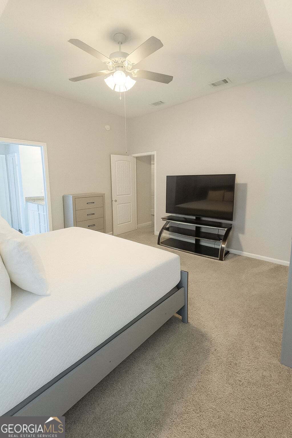 1343 Talmadge Road Allenhurst, GA 31301 - Photo 9 of 17 a bedroom with a bed and a chandelier