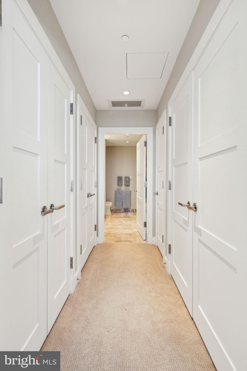 50 South 16th Street, Unit 5306 Philadelphia, PA 19103 - Photo 18 of 40 a view of a hallway with wooden shelves