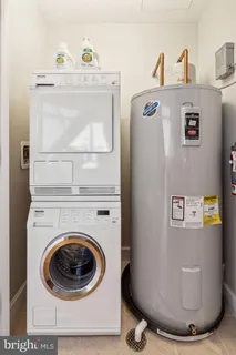 a view of a hallway with washer and dryer