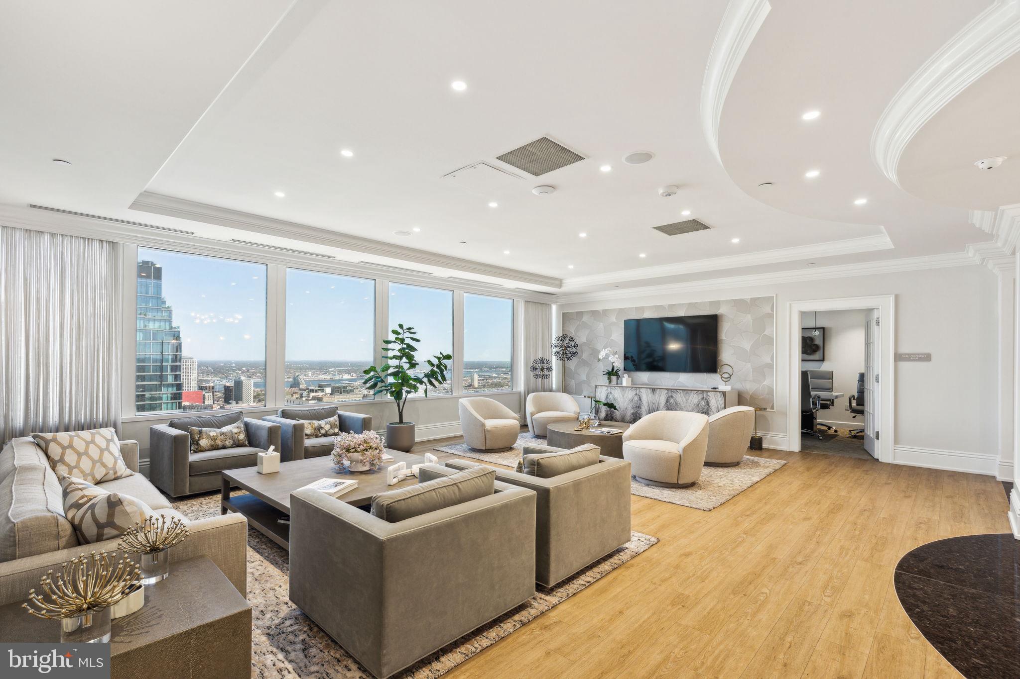 50 South 16th Street, Unit 5306 Philadelphia, PA 19103 - Photo 25 of 40 a living room with furniture and a flat screen tv