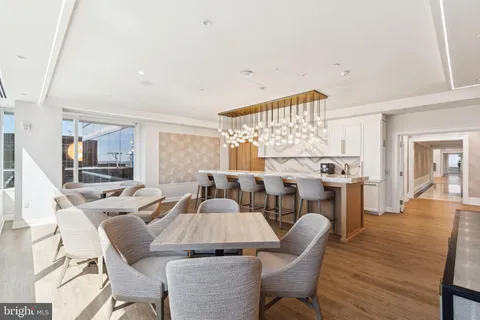 a living room with fireplace furniture and a wooden floor