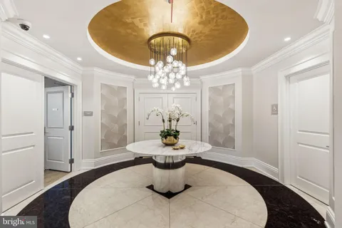 a dining room with table and chairs