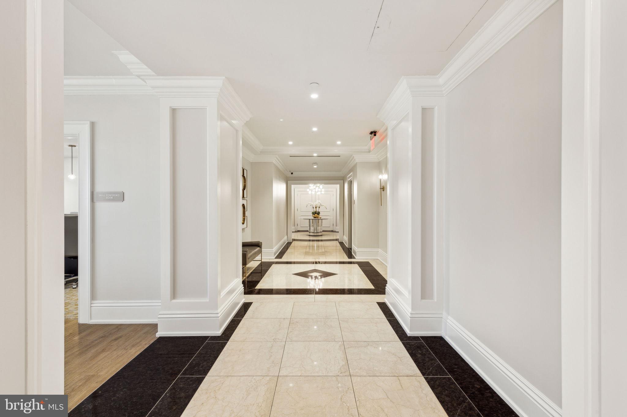 50 South 16th Street, Unit 5306 Philadelphia, PA 19103 - Photo 35 of 40 a view of a hallway with wooden floor and a large window