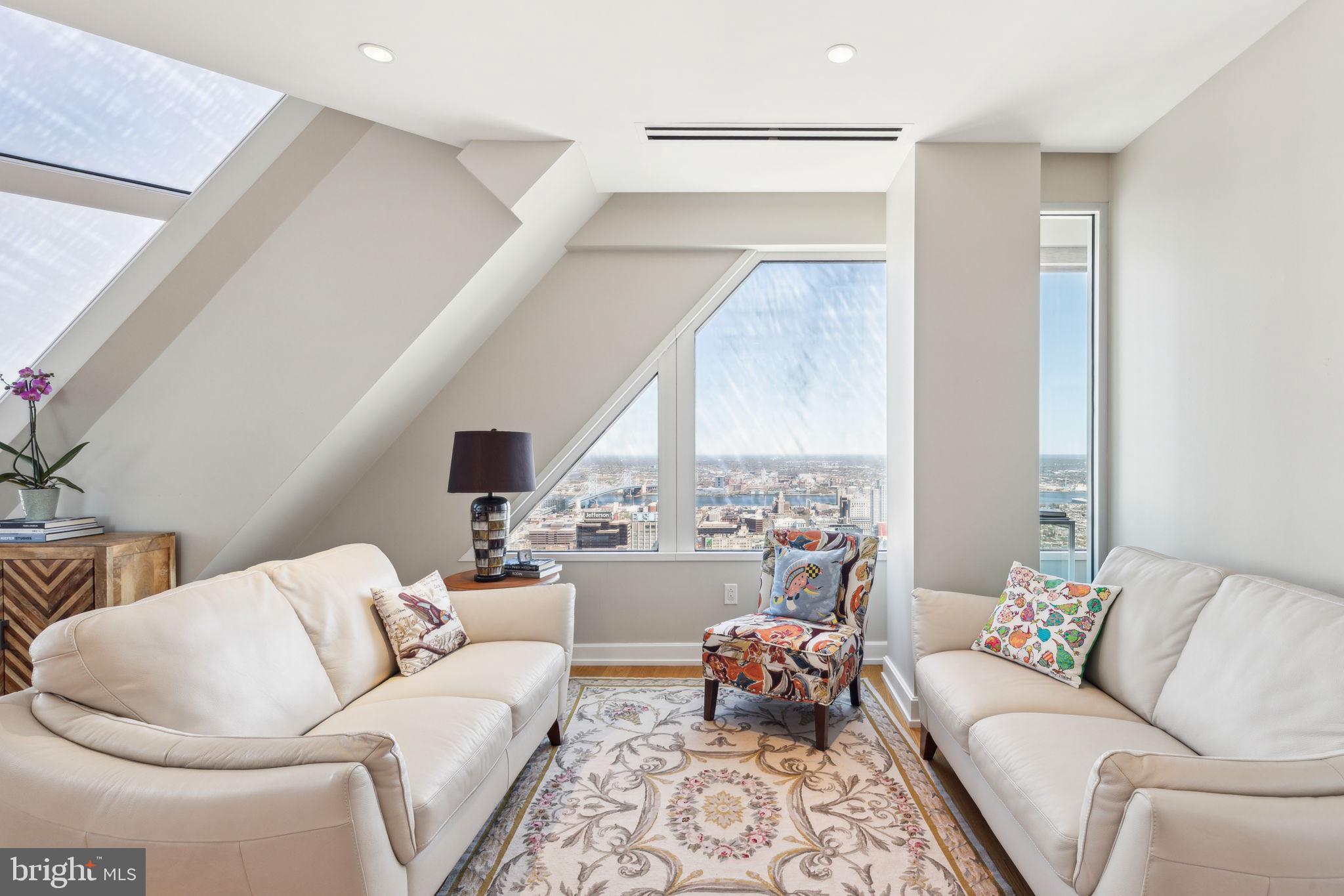 50 South 16th Street, Unit 5306 Philadelphia, PA 19103 - Photo 6 of 40 a living room with furniture and a large window