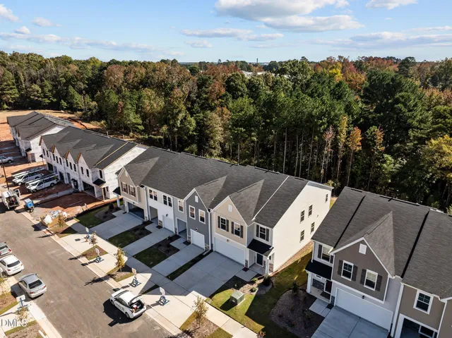 an aerial view of a house with outdoor space and street view