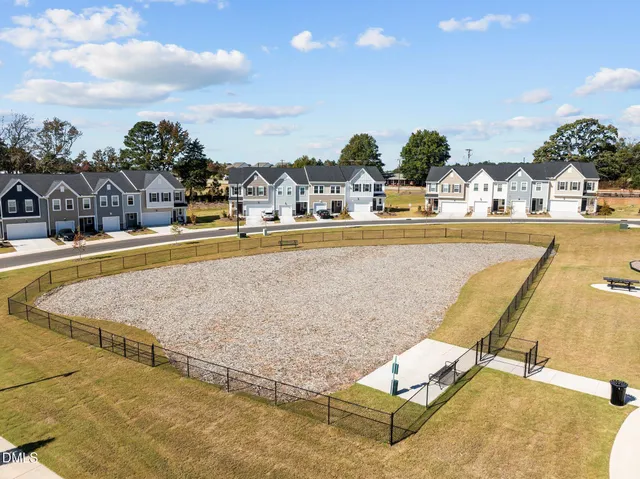 a view of a swimming pool with a lawn chairs