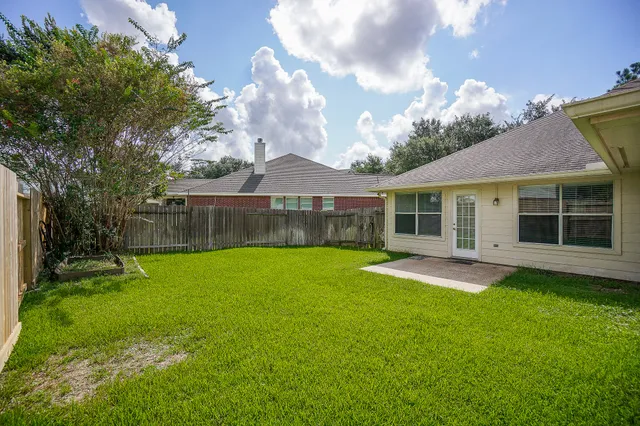 a view of a yard in front of a house