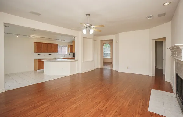 a view of a kitchen with a sink wooden floor and a kitchen