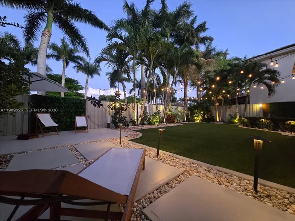 a view of a street with a building in the background