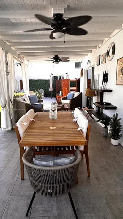 a outdoor dining space with furniture and outdoor view