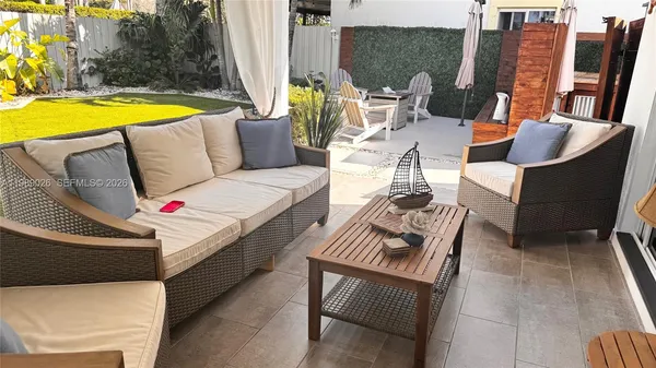 a view of swimming pool with seating area and furniture