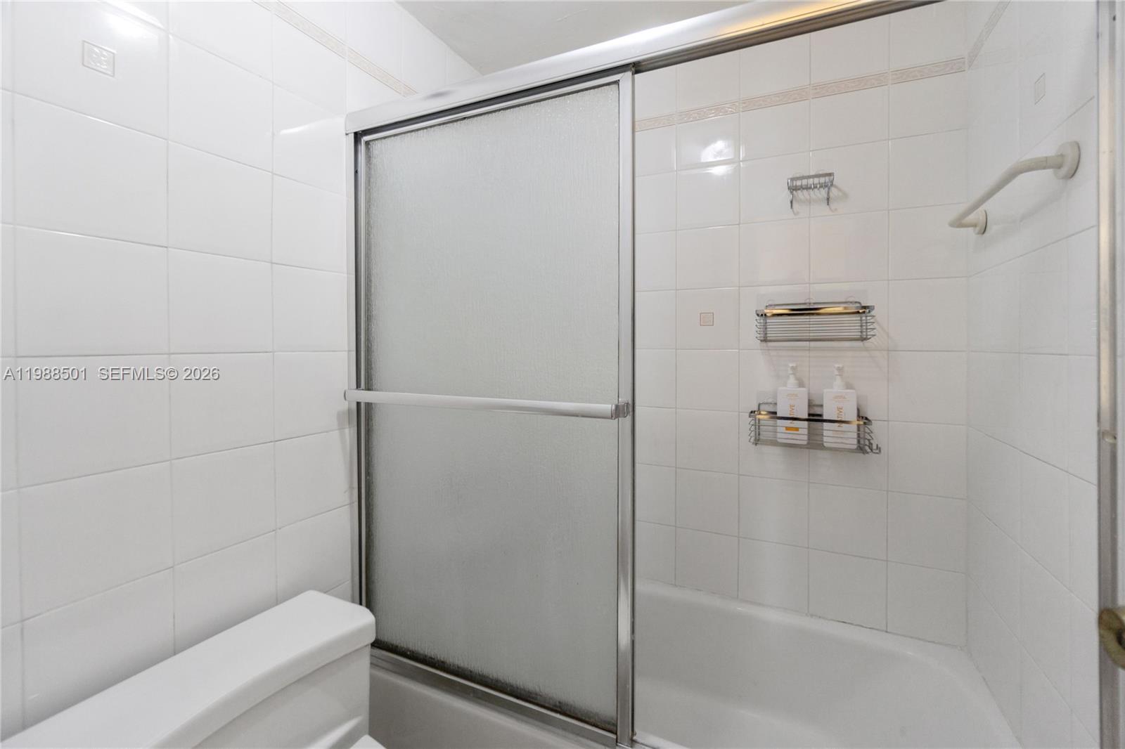 100 Lincoln Road, Unit 818 Miami Beach, FL 33139 - Photo 11 of 18 a bathroom with a shower