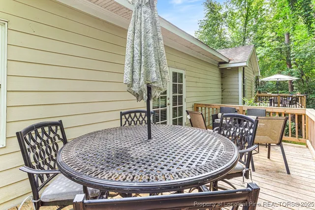a view of a lush green forest with large trees